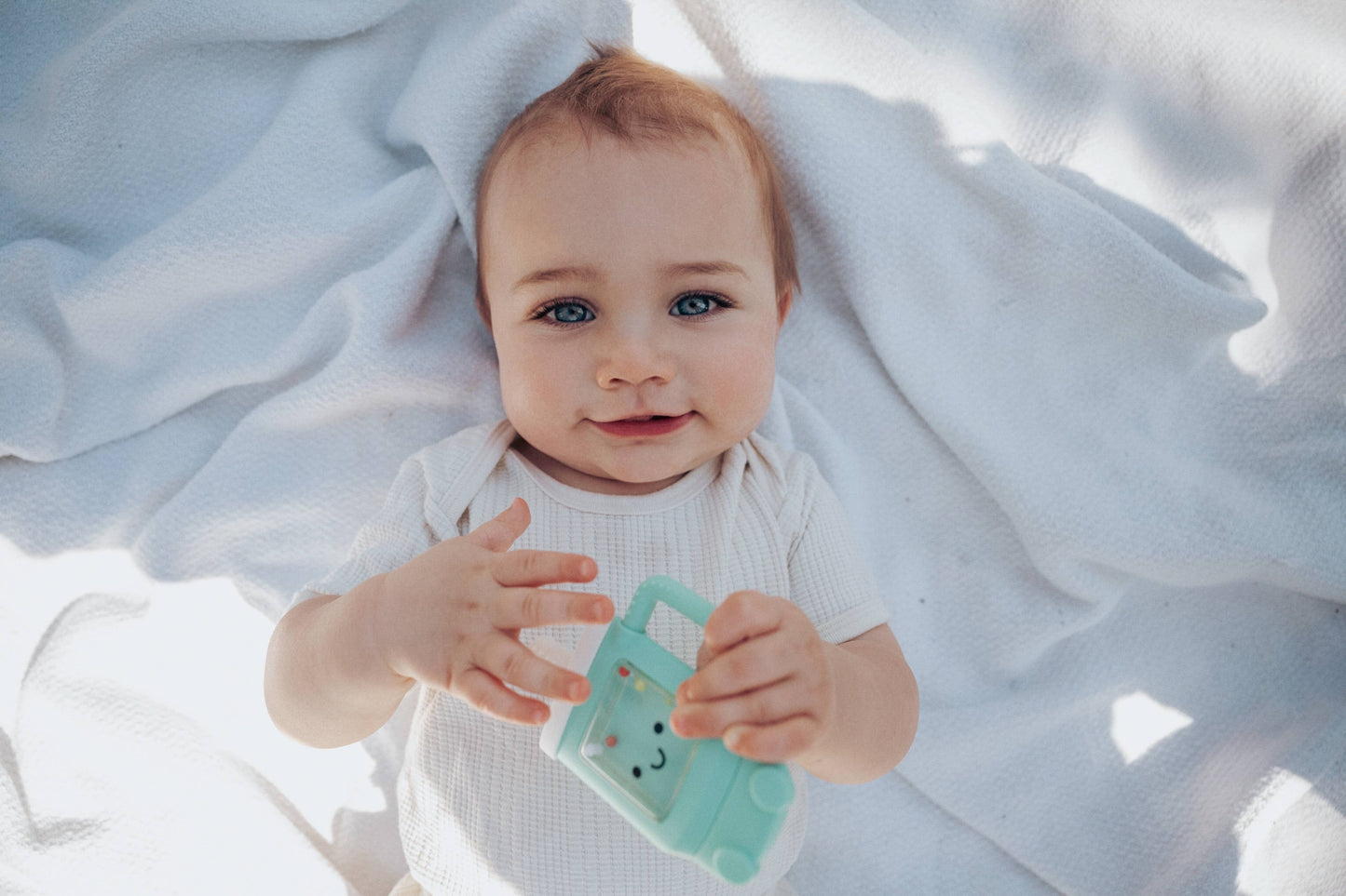 Itzy Ritzy - Sweetie Shake Plus™ - Teething + Rattle Toy